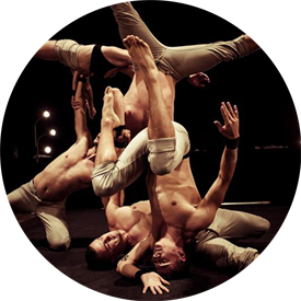 Acrobats performing gravity-defying feats