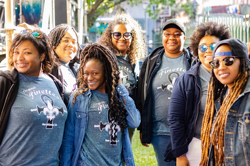 7 African American women stand together, smiling