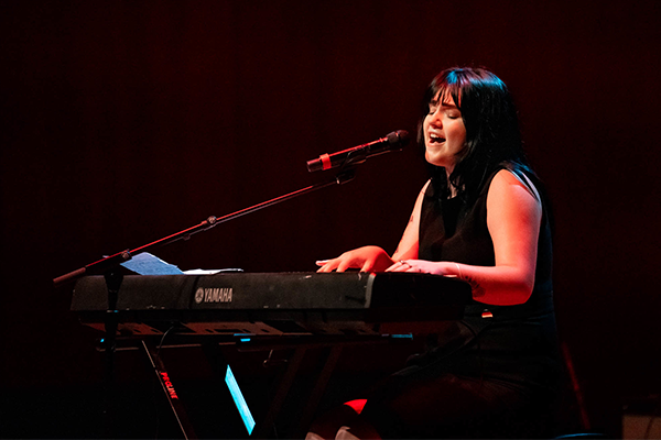 Urn plays piano and sings at Singer-Songwriter Showcase
