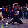 a bboy with his arm up and leg out at the Dance Battle Royale