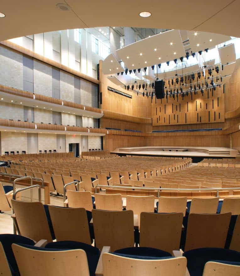 empty concert hall looking at the stage from the back of house right