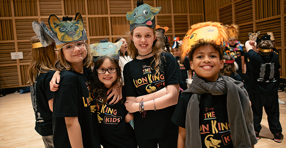 Students pose in Lion King costumes